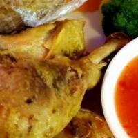 Gai Yang · Grilled chicken thigh seasoned with garlic and herbs served with steamed broccoli, carrots, ...