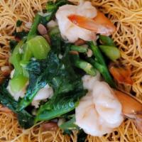Lad Nah Noodle · Crispy egg noodles in dark soy sauce, topped with broccoli, Chinese broccoli (seasonal) in o...