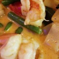 Red Curry · Bamboo shoots, bell pepper, string beans and fresh basil in a dried chili coconut sauce. Ser...