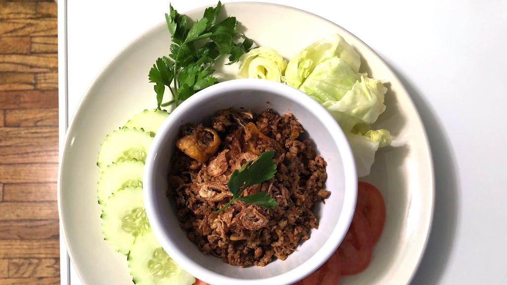 Laab Kur (Northern Thai Style) (Cannot Make It Not Spicy Or Mild Spicy) · Grounded pork, fried onions, scallions, cilantro, pig's ears all in northern Thai spicy and herbs, served with jasmine rice.
