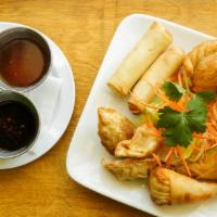 Mixed Appetizer · Two spring rolls, two curry puffs, two veg dumplings, and two shrimp rolls.