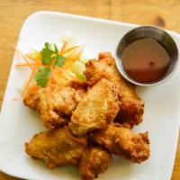 Wing · Fried chicken wings with sweet chili sauce.