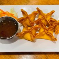 Crab Rangoon · Wontons stuffed with a mix of crabmeat, cream cheese, onion and celery served with sweet chi...