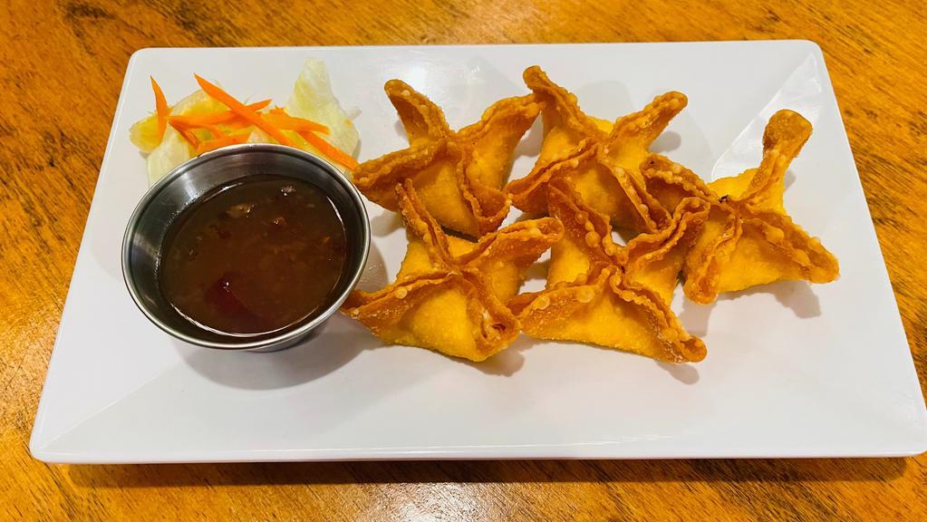 Crab Rangoon · Wontons stuffed with a mix of crabmeat, cream cheese, onion and celery served with sweet chili sauce.