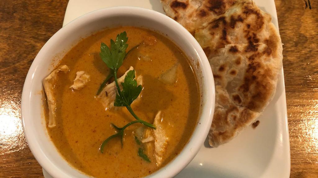 Roti Curry · Roti bread served with chicken in Massaman Curry dipping sauce.
