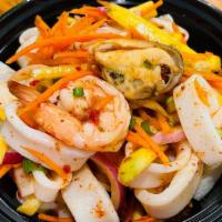 Seafood Salad · Shrimp, squid, mussels, red onion, scallion, carrot, chili paste with chili lime juice.
