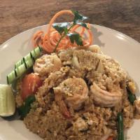 Tom Yum Fried Rice · Spicy fried rice with egg, lemongrass, lime leaves, onion, carrot, tomato, scallion, lime ju...