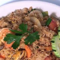 Seafood Fried Rice · Fried rice with egg, shrimp, squid, mussel, onion, carrot, tomato, scallion and chili paste.
