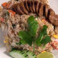 Lum Dee Fried Rice Sai Aue · Fried rice with egg, ginger, onion, tomato, carrot and scallion topped with Spicy Northern T...