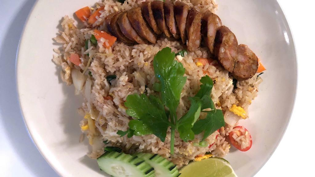 Lum Dee Fried Rice Sai Aue · Fried rice with egg, ginger, onion, tomato, carrot and scallion topped with Spicy Northern Thai Sausage.