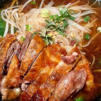 Duck Noodle Soup · Rice small noodle, chinese broccoli, bean sprout and scallion in duck soup topped with Crisp...