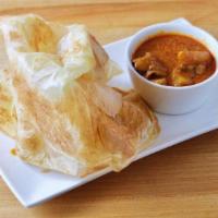 Original Roti 印度面包 · Spicy. Crispy on the outside, fluffy on the inside. Served with curry potato chicken sauce.