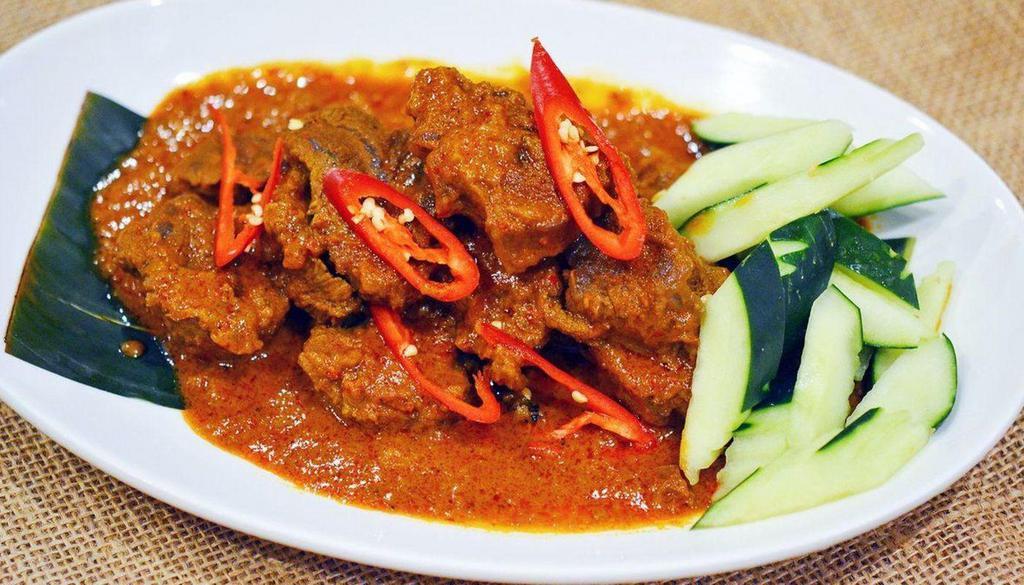 Indonesian Rendang 仁当咖喱 · Spicy. Aromatic house blend curry infused with chili paste, shallots and lemongrass. Served with rice.