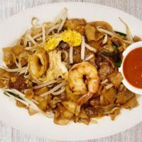 Penang Char Kway Teow (Shrimp+Calamari) 槟城炒果条 · Spicy. Penang's famous mild wok-tossed kway teow rice noodles, shrimp, calamari, egg, chives...