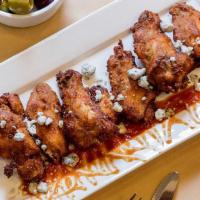 6 Piece Chicken Wings · With a blue cheese dip, carrots, and celery. Served plain or with a buffalo or BBQ sauce (op...