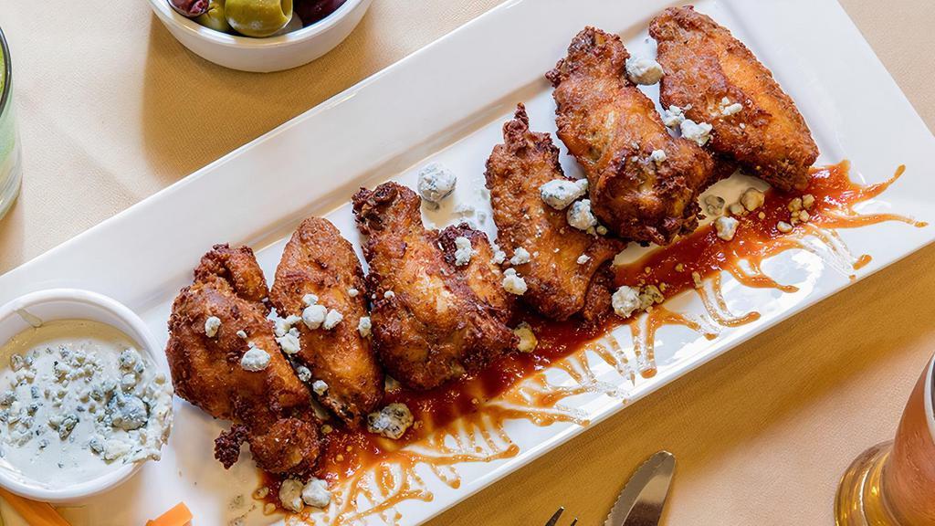 6 Piece Chicken Wings · With a blue cheese dip, carrots, and celery. Served plain or with a buffalo or BBQ sauce (optional).