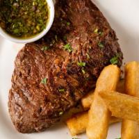 Flank Steak · Served with chimichurri sauce and crispy fried polenta.