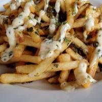 Lava Fries · Tossed with our home made chimichurri sauce and topped with chimichurri aioli.