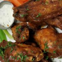 Chicken Wings · Buffalo or guava BBQ sauce, celery sticks, ranch.