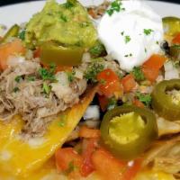 Nachos Grande · Jack and cheddar cheeses, black beans, guacamole, pico de gallo, jalapeños sour cream.