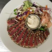 Sesame Ahi Tuna · Seared rare ahi tuna with sesame seeds and spices, side of wasabi, pickled ginger.