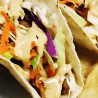 Teriyaki Chicken · Served in flour tortillas with our homemade slaw red onion, cilantro and aioli teriyaki.