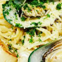 Lava Seafood Pasta · Fish of the day, shrimp, scallop and mussels sautéed with a cream sauce served over linguine...