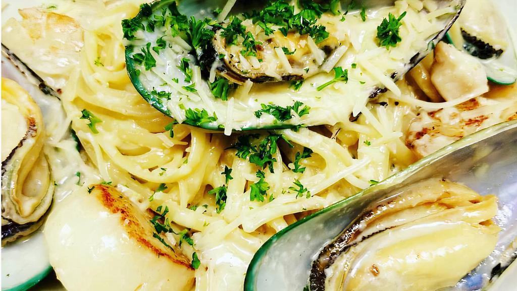 Lava Seafood Pasta · Fish of the day, shrimp, scallop and mussels sautéed with a cream sauce served over linguine pasta sprinkled with parmesan cheese.