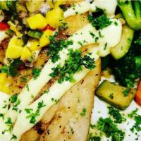 Island Fish · Fish of the day, with fresh herbs and spices, topped with mango salsa, lilikoi aioli, season...
