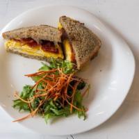 Bacon, Egg & Cheese · Two organic eggs, cheddar cheese, and two pieces organic bacon.