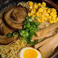Sapporo Miso Ramen · Chashu pork, half marinated egg, bamboo shoots, corn, wakame, scallions, and nori.