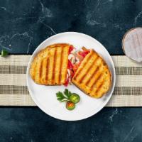Capri Panini · Smoked turkey, beef salami, provolone cheese, spinach, roasted peppers, and balsamic vinaigr...