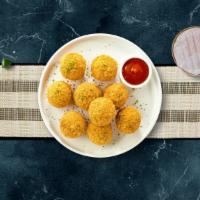 Mac & Cheese Balls · (Vegetarian) Bite-size clumps of mac and cheese breaded and fried until golden brown.