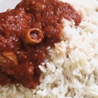 White Rice · Nigerian style white rice covered with beef stew. Served with your choice of chicken, beef o...