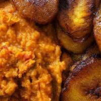 Ewa Riro (Honey Beans) With Fried Plantains · Nigerian honey beans  cooked in oil, peppers and tomato sauce mixed into porridge.