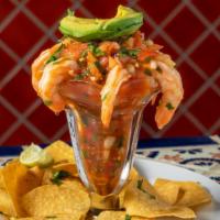 Ceviche De Camaron · Mexican-style shrimp ceviche with tomatoes, onions, cilantro, and avocado. Chips on the side.