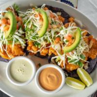 Baja Style Shrimp Tacos · Three shrimp tacos served on blue corn tortilla with lettuce, pico de gallo, and avocado. Ch...