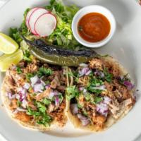 Tacos · Two soft corn tortilla tacos per order, garnished with onions and cilantro, served with rice...