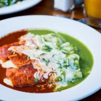 Enchiladas · Two Corn tortillas rolled, topped with green or red salsa, melted cheese, and served with ri...