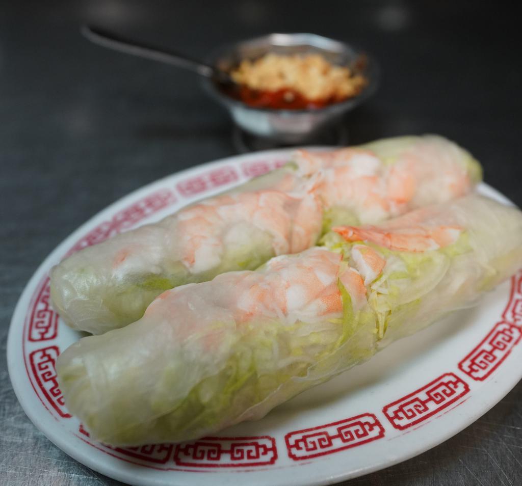 Spring Roll · Golden fried crispy rolls, served with sweet chili sauce.