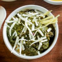 Saag Paneer · Creamy spinach and homemade cheese with ginger. Served with side.