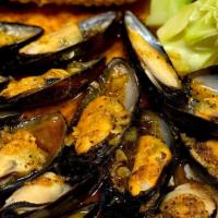 Large Catch Black Mussels · 1 lb fresh black mussels tossed in flavorful seasoning and spice of choice. Served with corn...