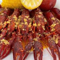 Large Catch Crawfish · 1 lb fresh crawfish tossed in flavorful seasoning and spice of choice. Served with corn and ...