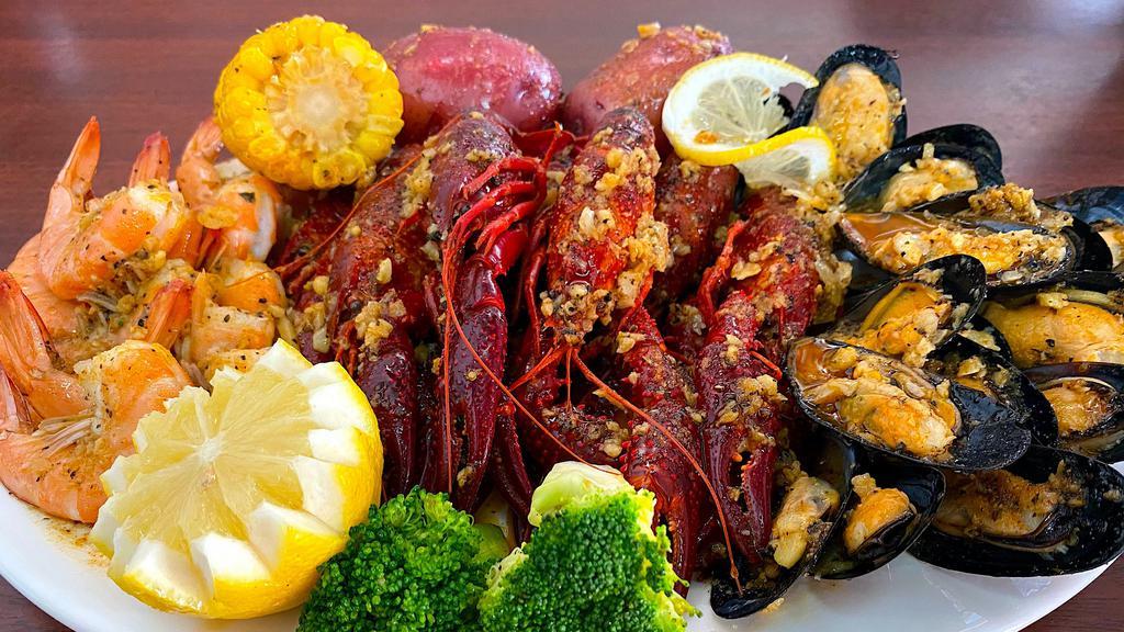 The Cajun Boil · come with shrimp head off 1/2 lb, crawfish 1/2 lb, black mussels 1/2 lb
one corn and one potato.