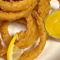 Onion Rings · Lightly battered, crunchy, savory onion rings pair with honey mustard is an absolute favorite.