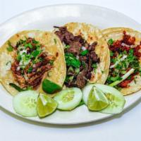 Tacos Mixtos · Mixed tacos. 
Choose from asada, pollo, pastor, chorizo or carnitas