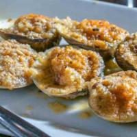 Vongole Oreganata · Baked stuffed clams with bread crumbs in white wine, lemon sauce.