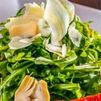 Pierrepi · Baby arugula, artichokes, sun dried and, and Parmesan cheese. (Gluten-Free option also avail...