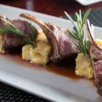Costolette Di Agnello Vino Rosso · Lamb chops sautéed in garlic red wine reduction served with polenta and mixed vegetables. (G...