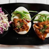 Chicken Nanban Buns · Steamed buns stuffed with boneless fried chicken with aJapanese bbq nanban sauce and shredde...